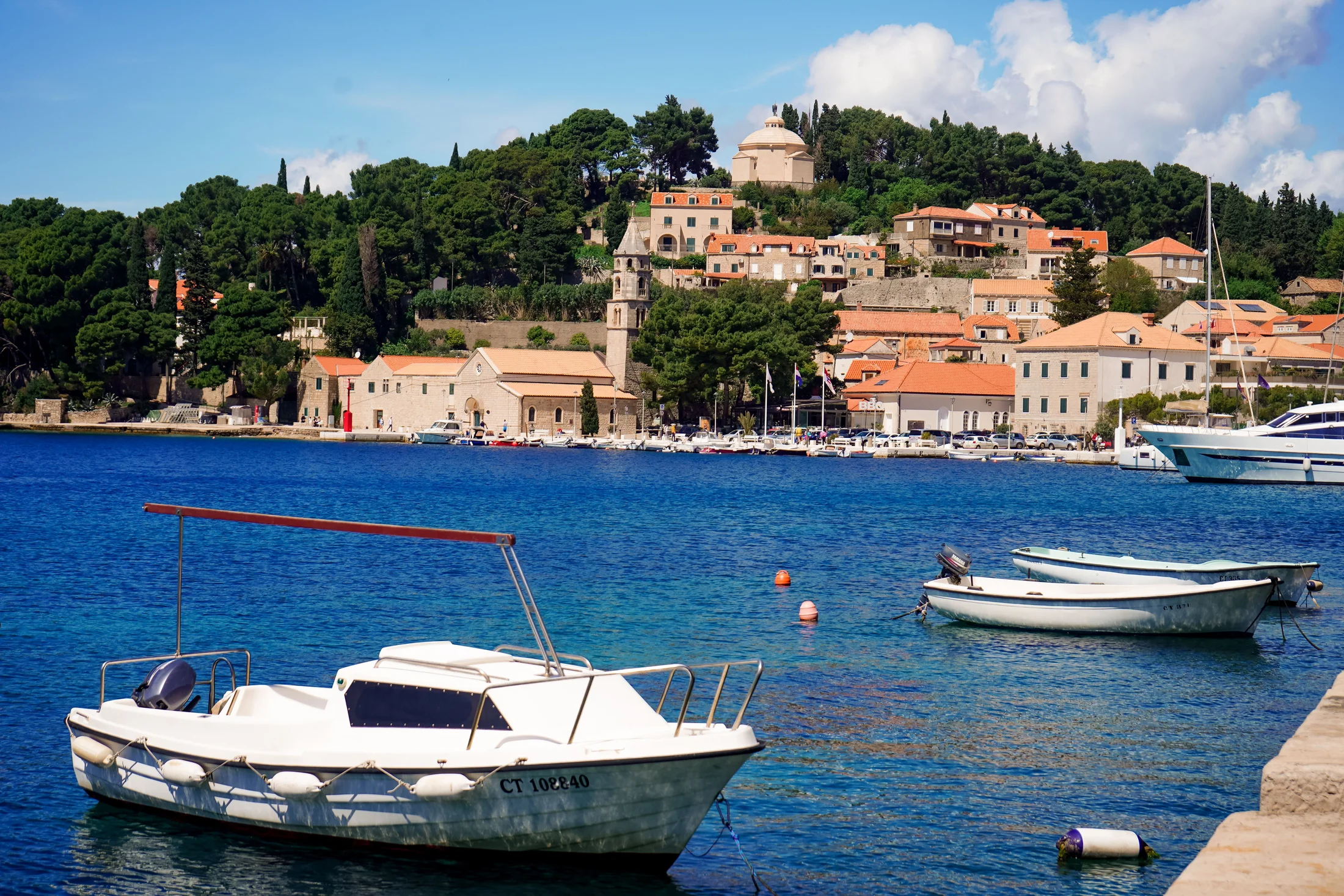 Boats moored in a harbour on the coast