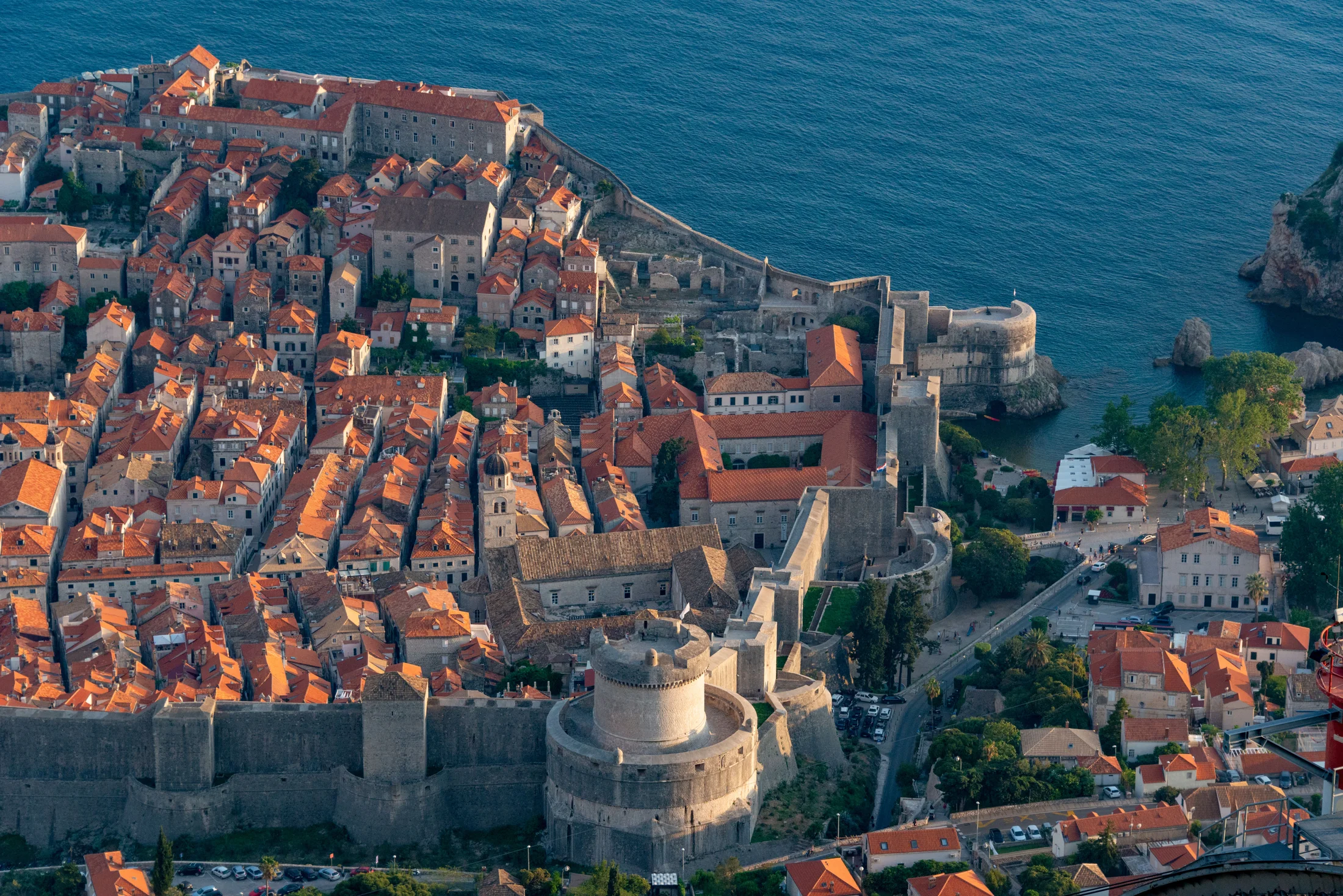 Dubrovnik city walls and terracotta rooftops beside the sea